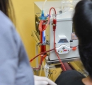 2 nurses performing an extracorporeal blood ozonation and oxygenation treatment.