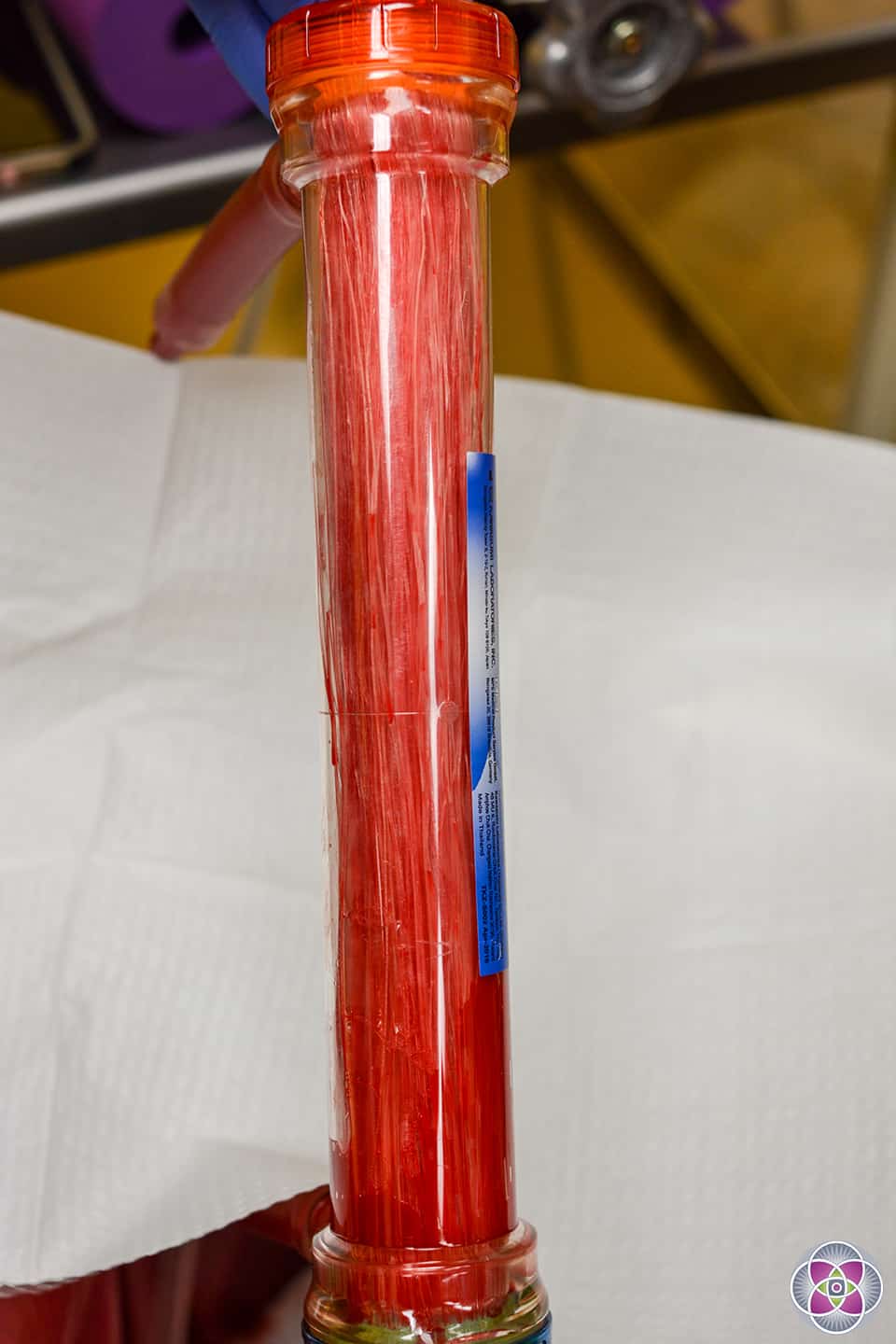 A used EBOO /F dialyzer / filter filled with debris it removed from a patient's blood.