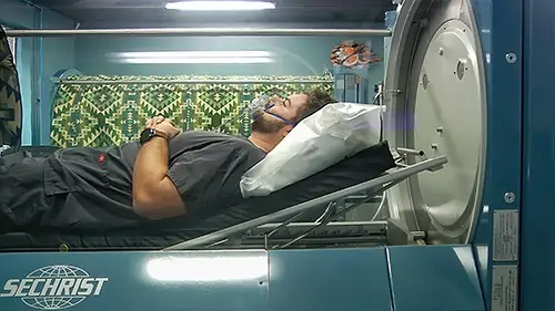 Cameron in a Hyperbaric Oxygen Chamber which is great for the Long COVID neurological issues.