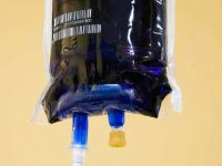 Close-up of an intravenous bag filled with dark blue Methylene Blue solution for patient infusion.