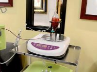 Blood swirling in the apparatus during the Hyperbaric Ozone Therapy (10-Pass) process for patient treatment.