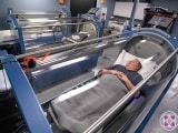 2 People in hyperbaric oxygen therapy chambers