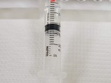 Syringe of stem cells ready for infusion.