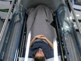A patient in a hyperbaric oxygen chamber from above.