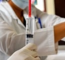 syringe-full-of-mesenchymal-stem-cells-with-doctor-in-background